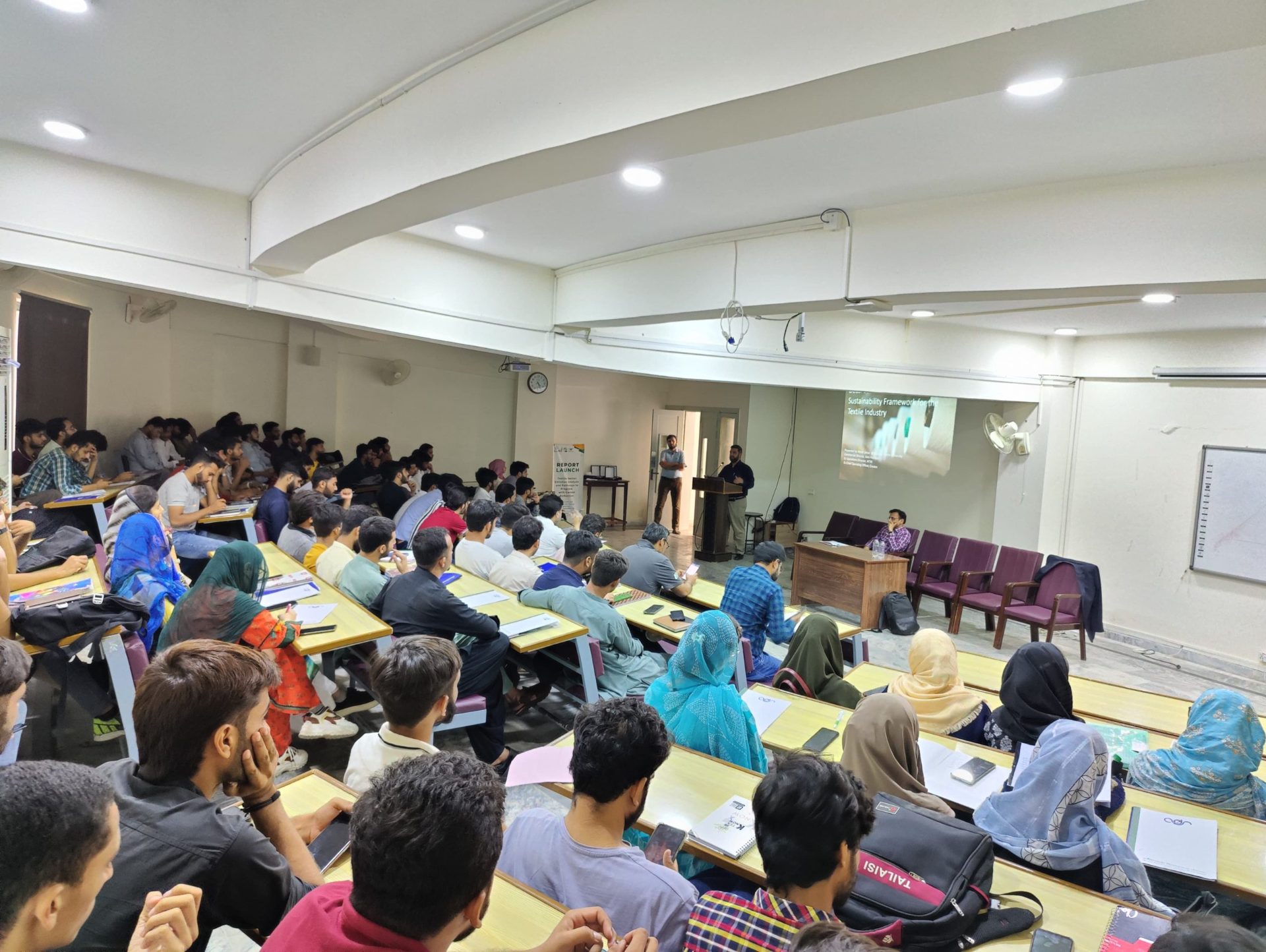Students and faculty at the launch of ADS's textile sector study, National Textile University, Faisalabad.