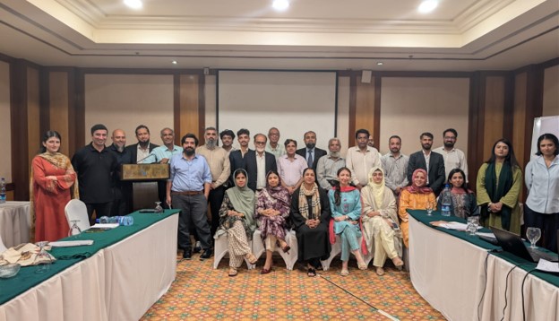 Photo from the report: Group photo of speakers, panelists and participants at the conclusion of the Threads of Accountability dialogue, Avari Towers, Karachi.